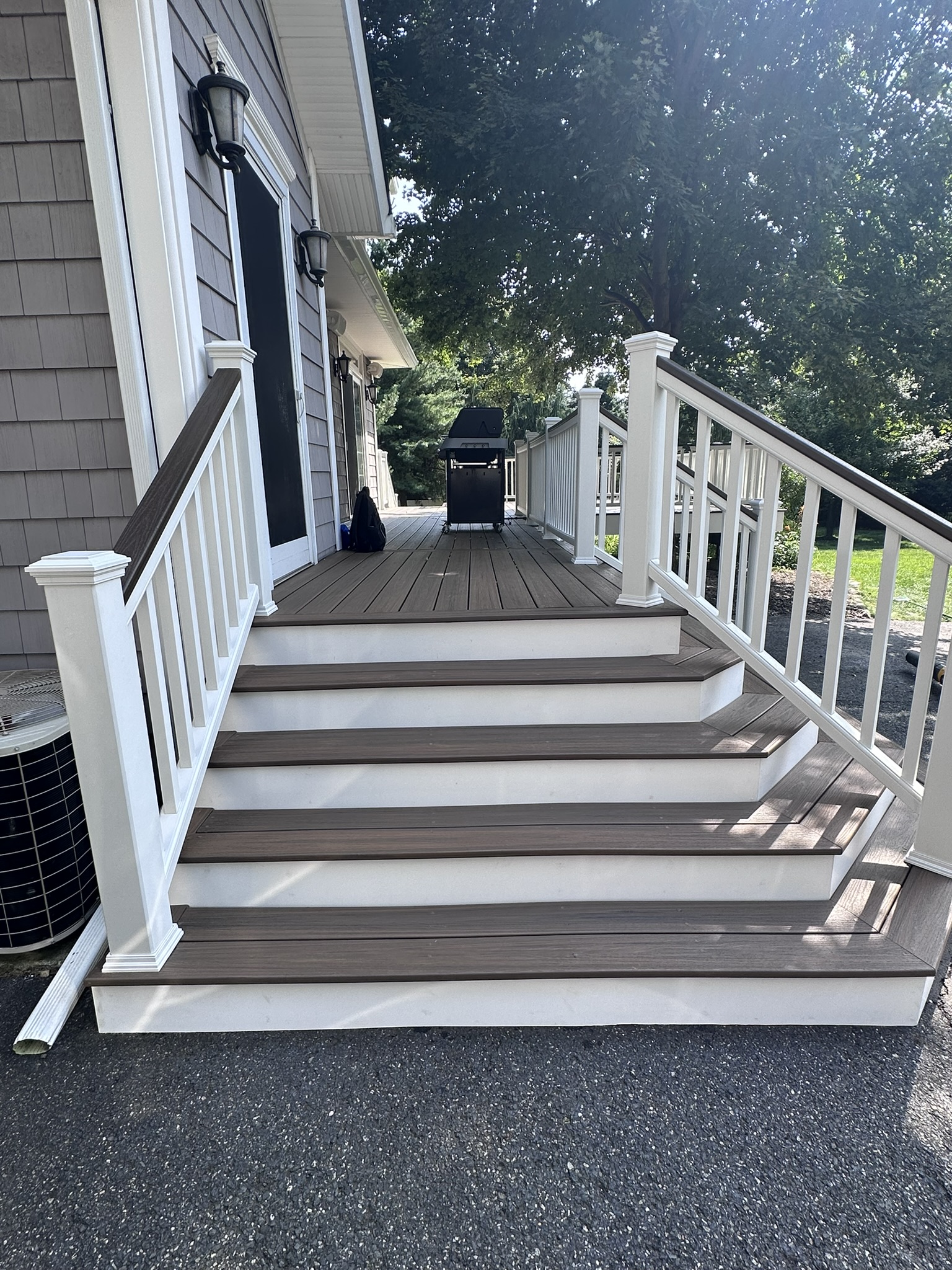 Side view of the wrapped cascading stairs at a Glen Rock NJ deck, showing the angled treads